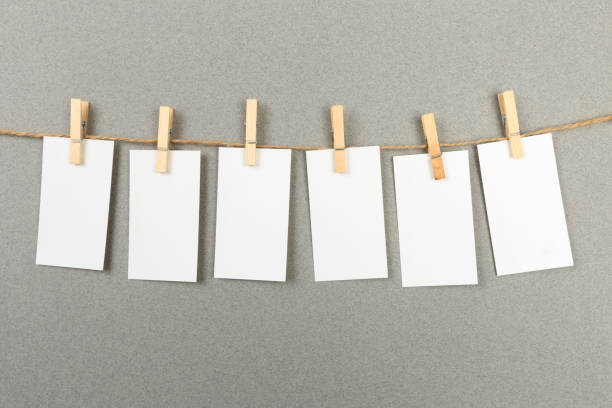 istock collection of various notes and a clothes pegs on grey background with clipping path 1198578203