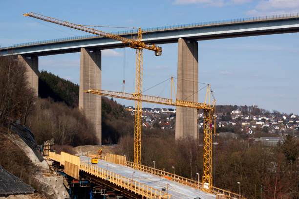 istock A new bridge under construction in the background a highway bridge 1198582145