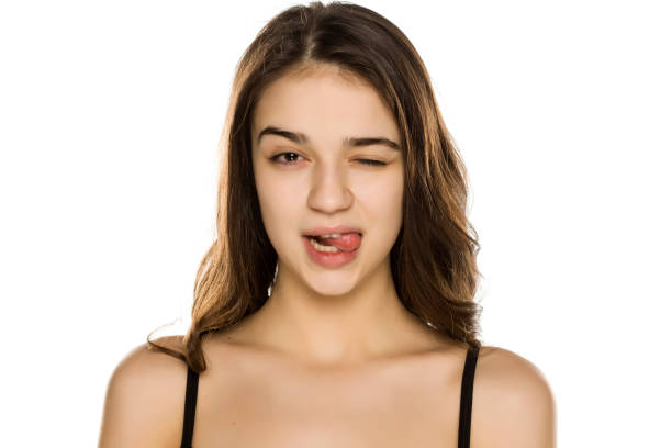 istock Young beautiful funny woman without makeup on white background 1198585493