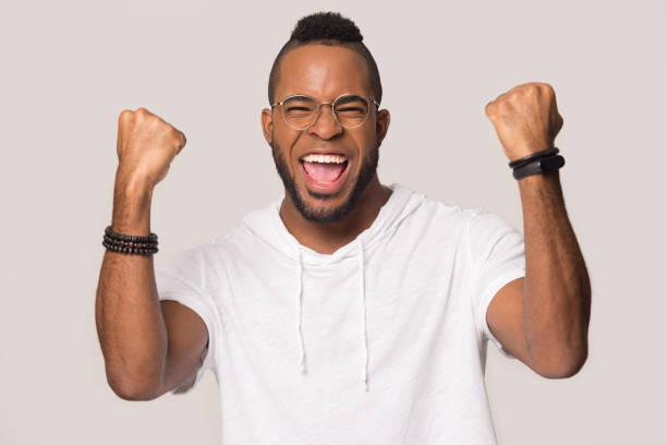 istock Overjoyed african American man feel euphoric with victory 1198585641