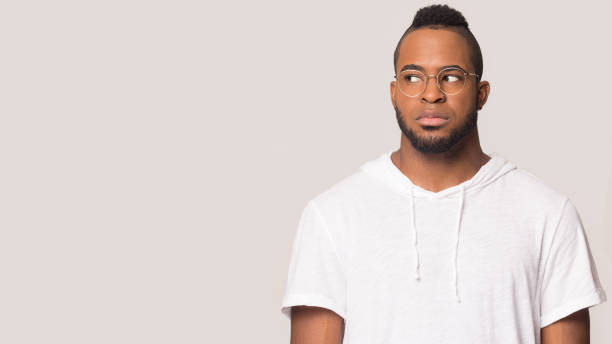 istock Serious african American man look at blank copy space 1198585650
