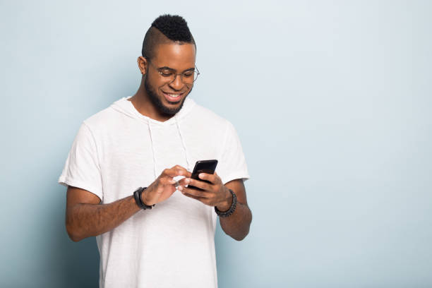 istock Happy biracial man browsing unlimited wireless internet on smartphone 1198585659