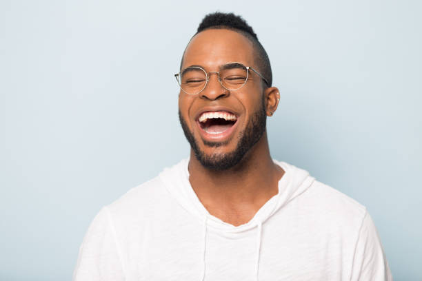 istock Overjoyed african American man laugh at funny joke 1198585665
