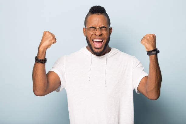 istock Overjoyed biracial male feel euphoric celebrating success 1198585667