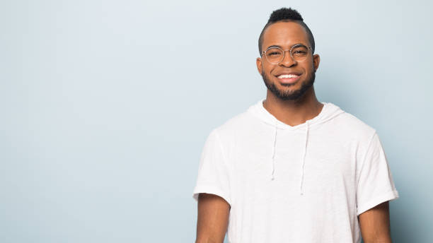 istock Smiling biracial man in glasses posing near blank copy space 1198585669