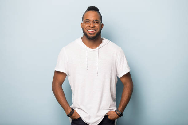 Smiling african America man in glasses posing in studio