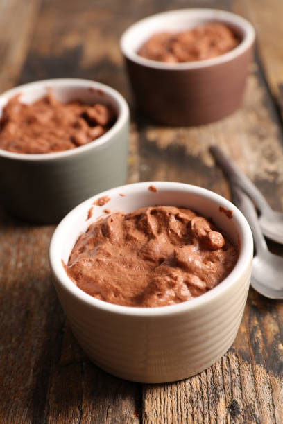 istock delicious creamy chocolate mousse on wood background 1198585762