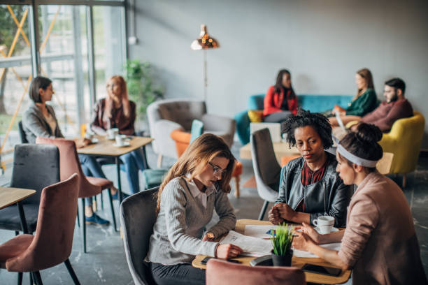istock Group of friends working in cafe 1198586792
