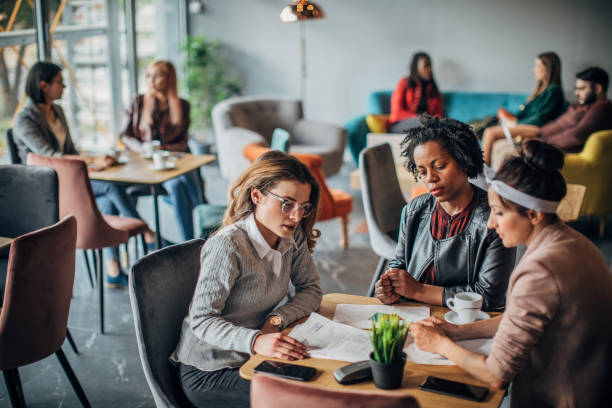istock Group of friends working in cafe 1198586836