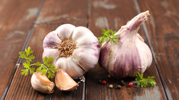 istock garlic clove and bulb on wood background 1198586880