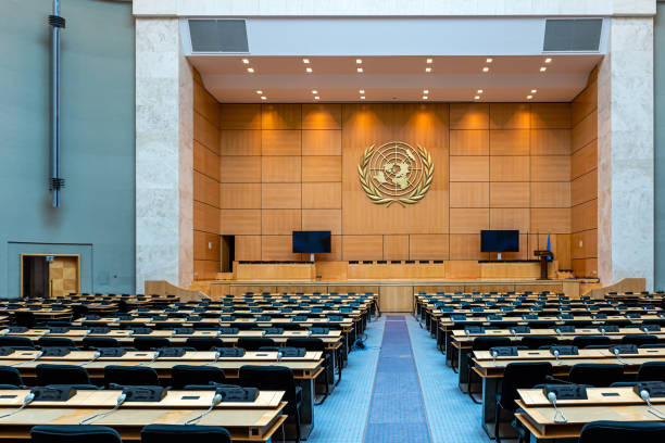 An assembly hall in the Palace of Nations - UN headquarters in Geneva, Switzerland Geneva, Switzerland - April 15, 2019:  An assembly hall in the Palace of Nations - UN headquarters in Geneva, Switzerland - image united nations stock pictures, royalty-free photos & images