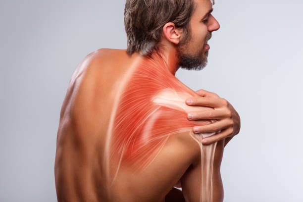 istock Shoulder pain. Man holding a hand on shoulder 1198589104