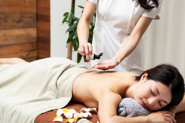 istock Woman receiving massage using aroma oil 1198589176