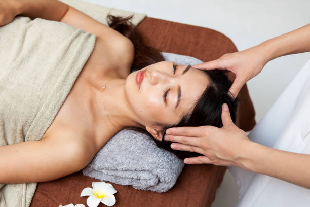 istock Woman receiving head massage 1198589342