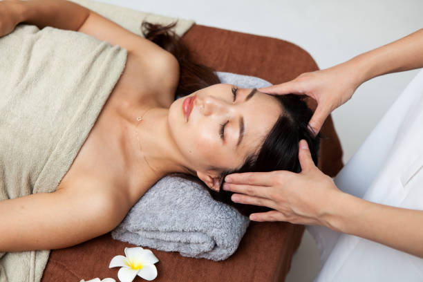 istock Woman receiving head massage 1198589361