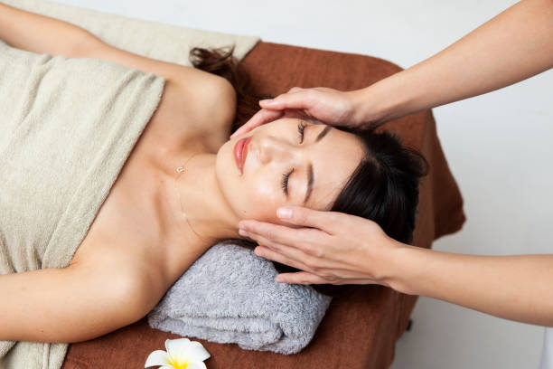 istock Woman receiving head massage 1198589367
