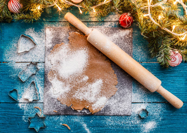 istock Photo of rolling pin, dough, spruce branches, garlands 1198589995