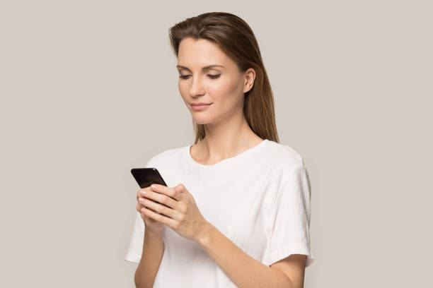 istock Millennial girl using browsing internet on smartphone 1198590543