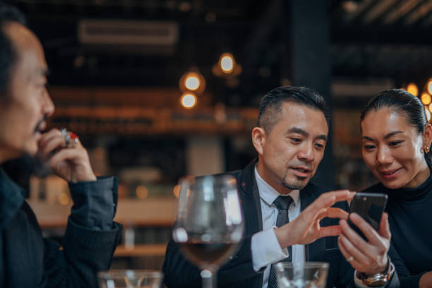 istock Business people sitting in restaurant 1198592285
