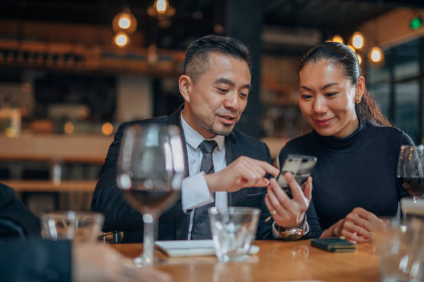 istock Business people sitting in restaurant 1198592313