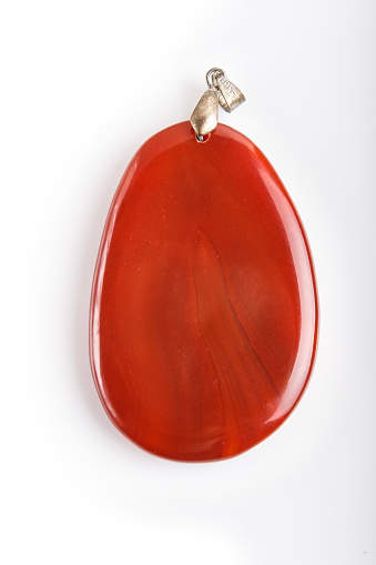 red onyx pendant  isolated  on white background, close up.