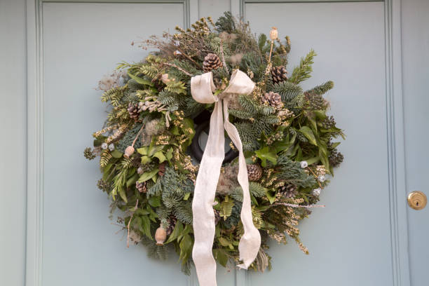 istock Green Leaf and White Ribbon on Christmas Wreath 1198593752