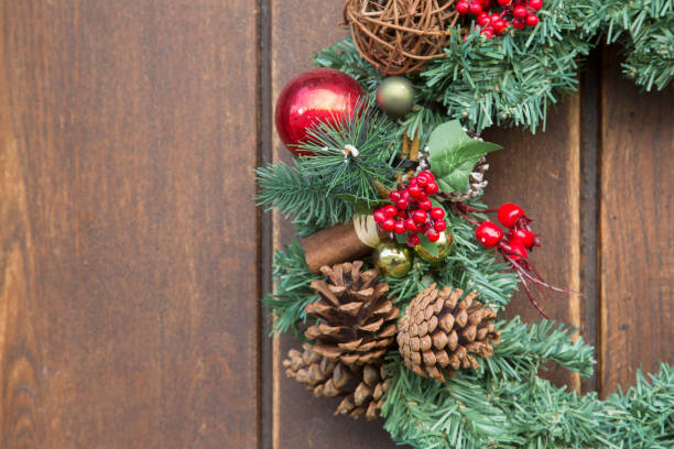 istock Fir Cones and Red Berries on Christmas Wreath 1198594267