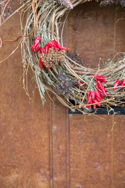 istock Red Peppers and Cone; Christmas Wreath 1198594286