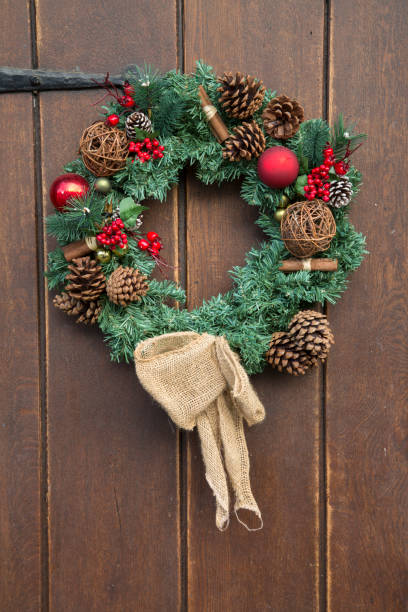 istock Fir Cone and Red Balls on Christmas Wreath 1198595045