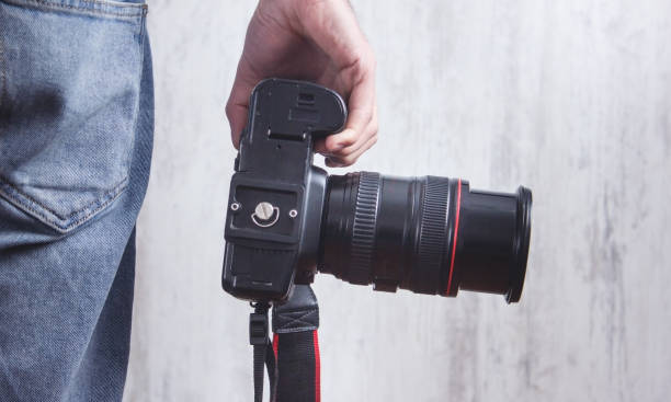 istock Photographer with a Camera. Lifestyle, Work 1198595370