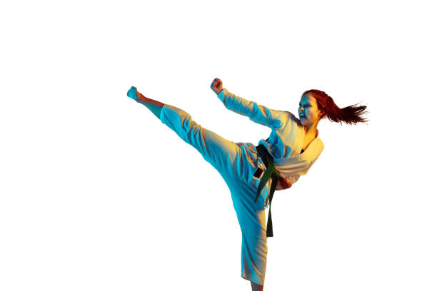 istock Confident junior in kimono practicing hand-to-hand combat, martial arts 1198595380