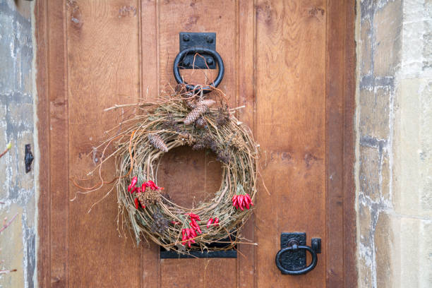 istock Red Peppers and Cones on Christmas Wreath 1198595634