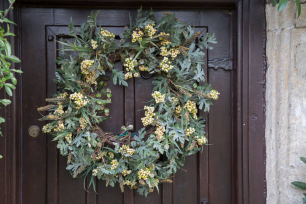 istock Mistletoe Green Leaf and Berry on Christmas Wreath 1198595703