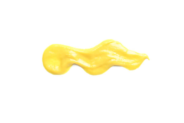 istock Cheese or mustard sauce smear isolated on white background 1198597015