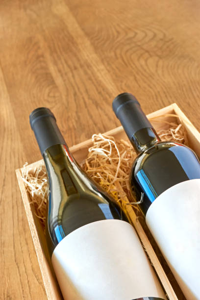 istock Wine bottles with blank label in wooden gift box 1198598274