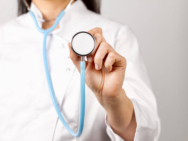 istock female doctor holding a stethoscope 1198599824