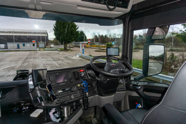 Scania V8 Semi Truck Interior View of Drivers Cockpit. Corby, Northamptonshire / UK, Scania V8 Semi Truck Interior View of Drivers Cockpit showing the controls and Navigation Equipment and Camera Screens. semi truck audio stock pictures, royalty-free photos & images