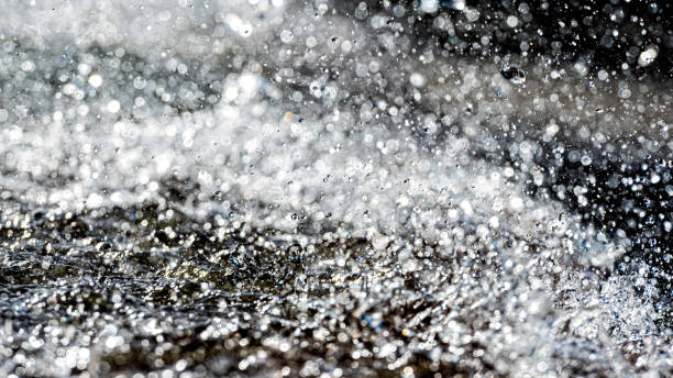 istock Water splash with small drops in the fountain. Abstract natural, selective focus  background 1198599947
