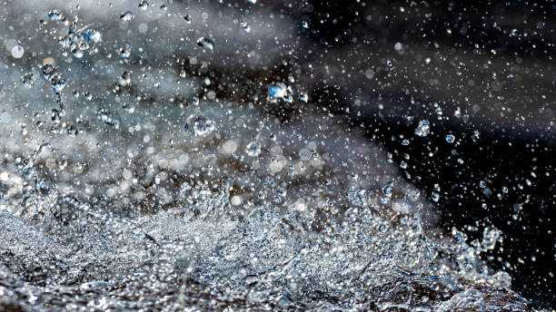 istock Water splash with small drops in the fountain. Abstract natural, selective focus  background 1198600027