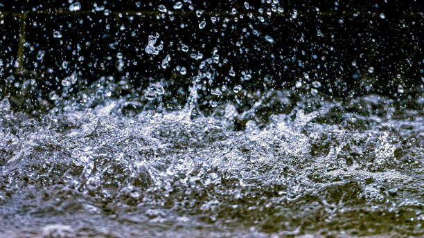 istock Water splash with small drops in the fountain. Abstract natural, selective focus  background 1198600058