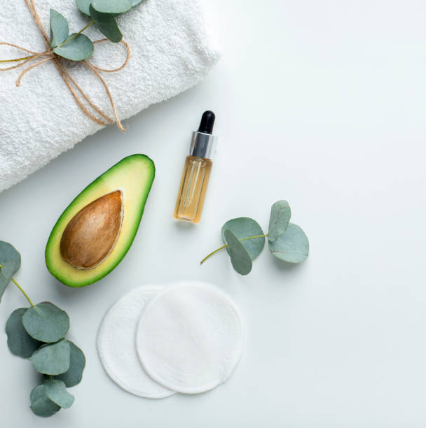 istock Fresh avocado oil in small bottle on white background 1198603334