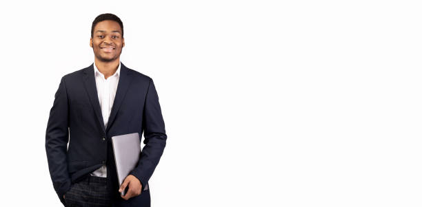 istock Confident black man with laptop on white background 1198605505
