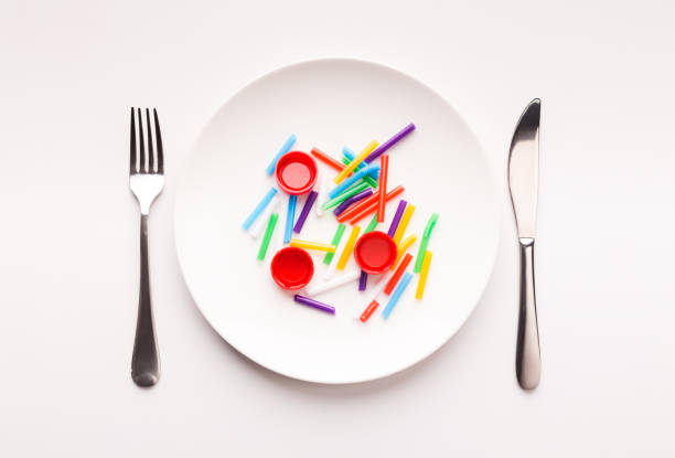 istock Plastic waste ready to eat on a plate set for lunch 1198606100