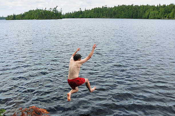 istock Man Jumping into a Lake 119860782