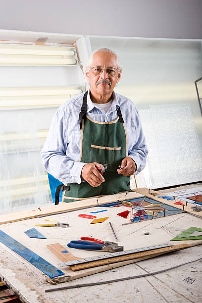 istock Stained glass craftsman working on project 119860910