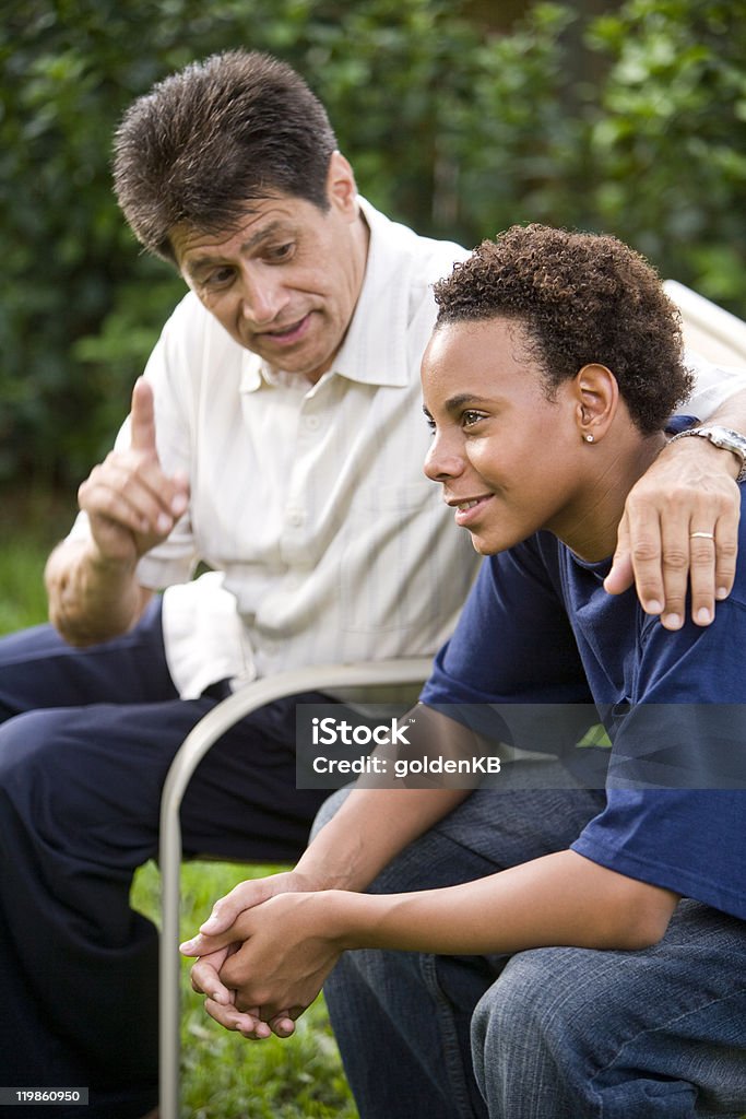 Teenage son listening to father's advice  Teenager Stock Photo