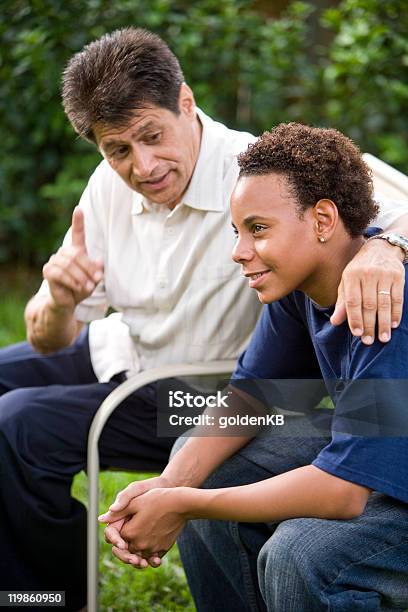 Teenage Son Listening To Fathers Advice Stock Photo - Download Image Now - Teenager, Discussion, Parent