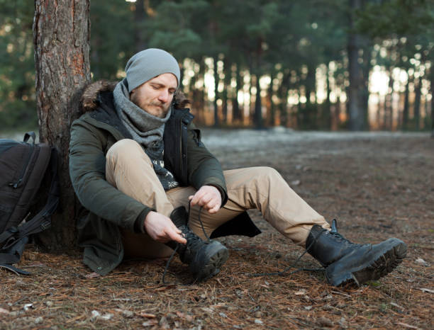 istock Pensive hipster guy wanderlust with touristic backpack enjoy tranquility during exploring nature environment, male hiker thinking about route to discover 1198610720