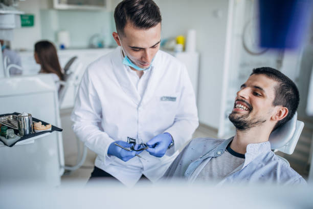 istock Young man at the dentist ordination 1198611526