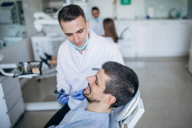 istock Young man at the dentist ordination 1198611539